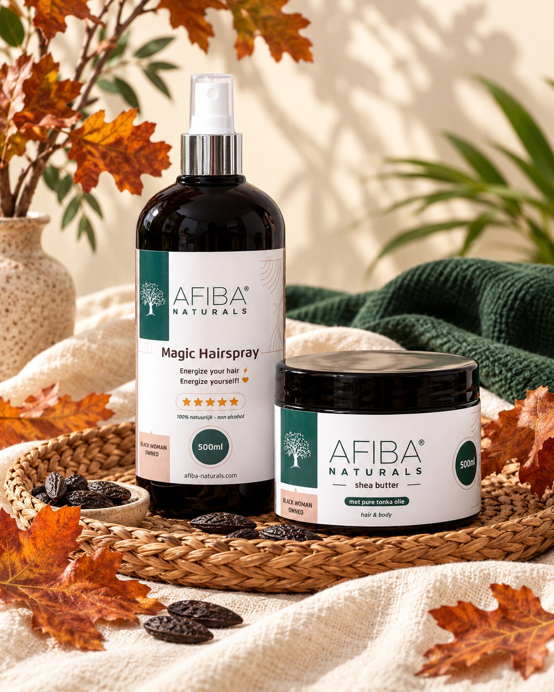 Afiba Naturals Magic Hairspray en Shea Butter met Tonka Olie op een gevlochten schaal met herfstbladeren